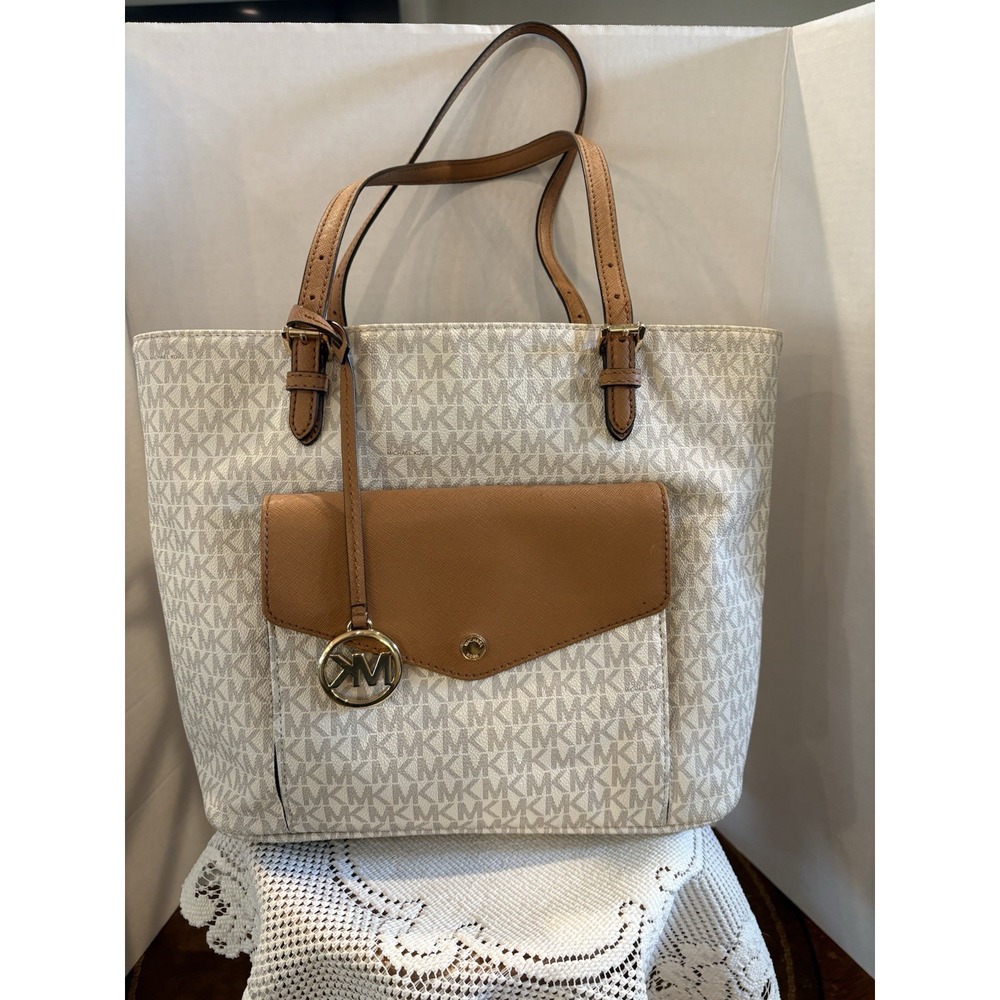 Michael Kors Jet Set Medium Multifunction Logo Pocket Tote in Vanilla and Acorn.